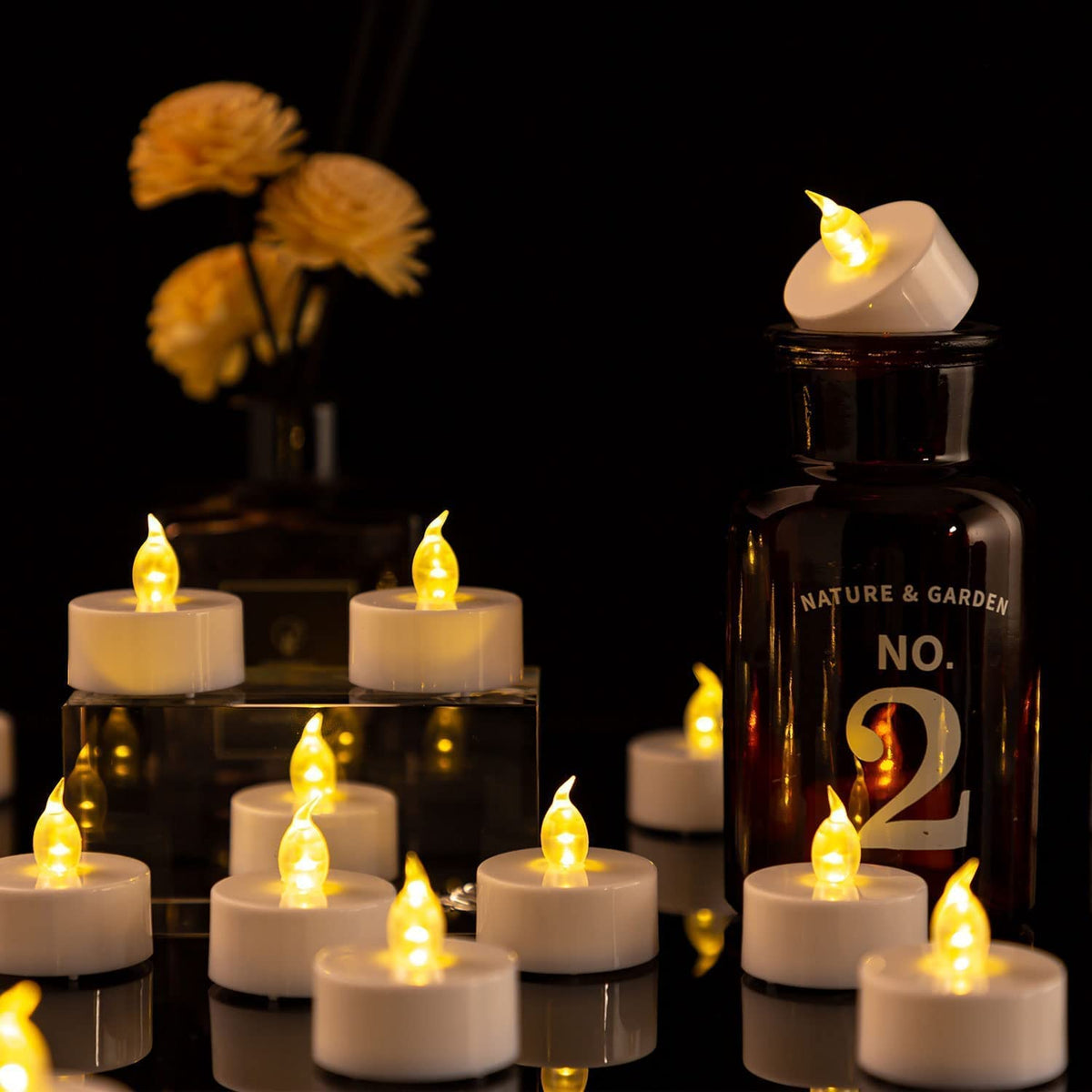 Hanzim LED Tea Lights Candles- 100PACK Warm Yellow Flameless Candles Realistic and Bright Flickering Long Lasting 200Hours for Holiday Celebration,Party,Home Decoration,Battery Operated